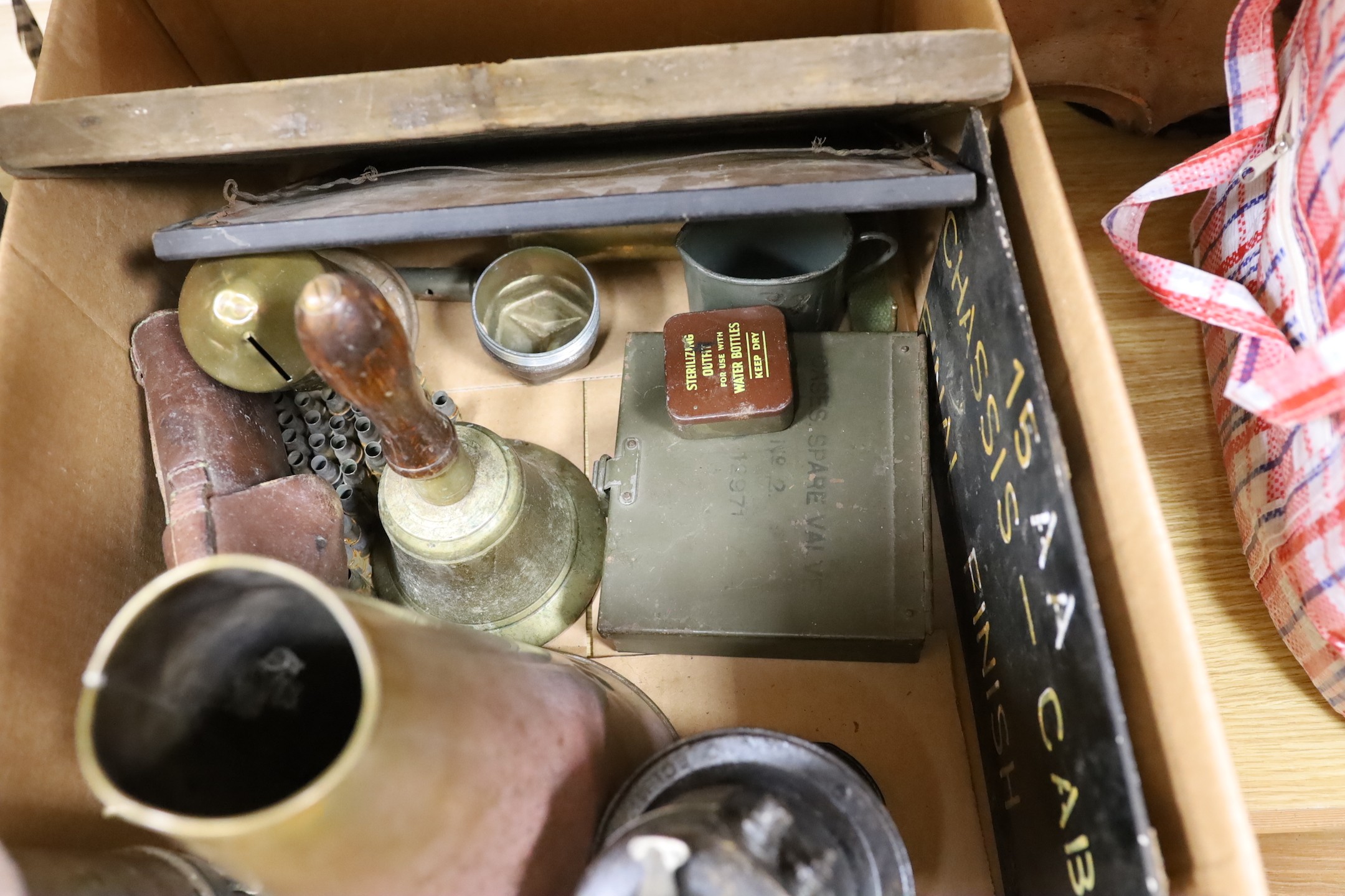 World War Two accessories to include an ARP hand-bell, three compasses and a brass loud-haler